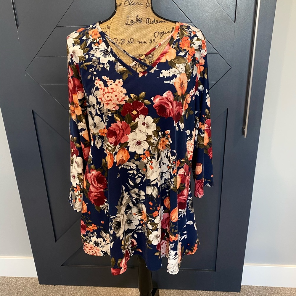 Floral tunic with crossover neckline. Size XXL